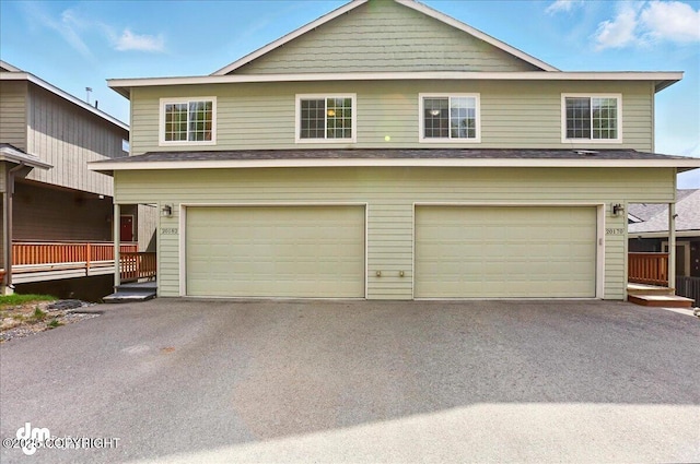20182 Eagles Nest Ct # 5B, Eagle River, AK 99577 - view of front of house featuring an attached garage and driveway