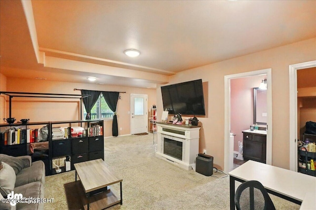 20182 Eagles Nest Ct # 5B, Eagle River, AK 99577 - carpeted living area with a fireplace and baseboards