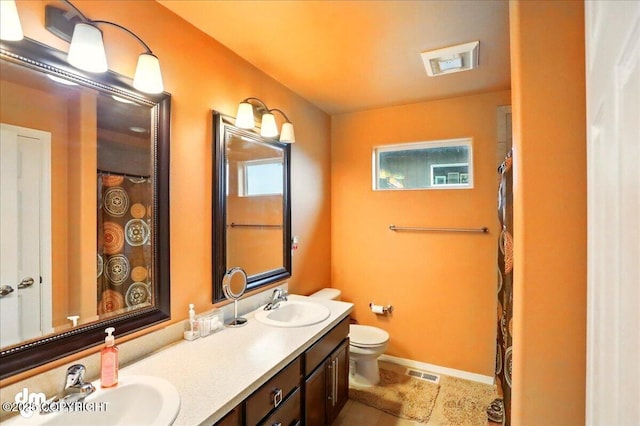 20182 Eagles Nest Ct # 5B, Eagle River, AK 99577 - bathroom with toilet, double vanity, and tile patterned flooring