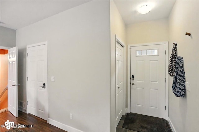 20182 Eagles Nest Ct # 5B, Eagle River, AK 99577 - entrance foyer featuring baseboards and dark wood-type flooring