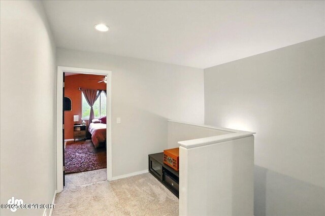20182 Eagles Nest Ct # 5B, Eagle River, AK 99577 - corridor featuring an upstairs landing, carpet, recessed lighting, and baseboards