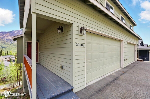 20182 Eagles Nest Ct # 5B, Eagle River, AK 99577 - garage featuring a mountain view