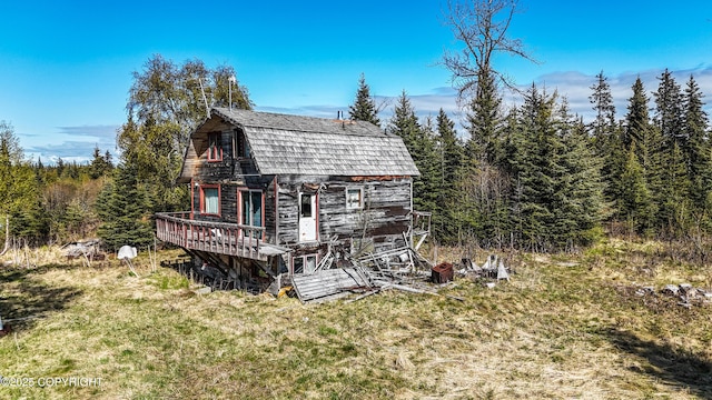 21572 Twilight St, Ninilchik, AK 99639 - view of property exterior featuring a gambrel roof and an outbuilding