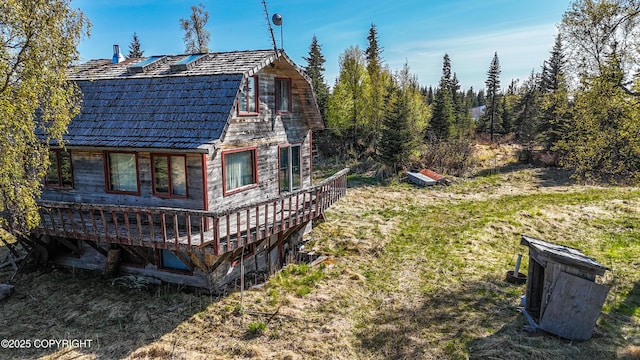 21572 Twilight St, Ninilchik, AK 99639 - view of side of home with a wooden deck