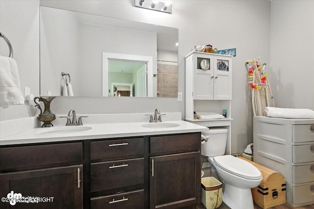 1521 N Kerry Ln, Wasilla, AK 99654 - bathroom featuring toilet and double vanity
