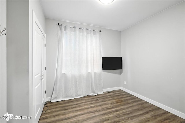 1521 N Kerry Ln, Wasilla, AK 99654 - empty room featuring wood finished floors and baseboards
