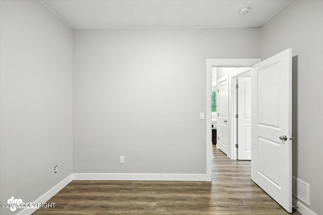 1521 N Kerry Ln, Wasilla, AK 99654 - unfurnished room featuring dark wood-style floors and a smoke detector