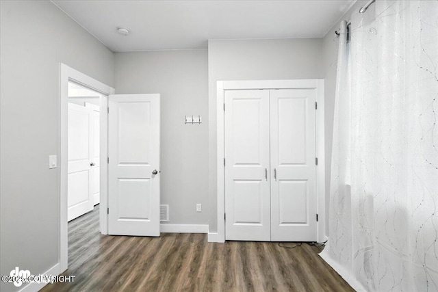 1521 N Kerry Ln, Wasilla, AK 99654 - unfurnished bedroom with wood finished floors and a closet