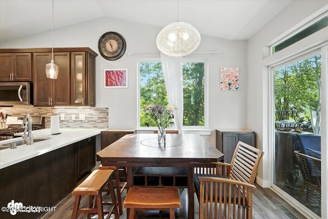 1521 N Kerry Ln, Wasilla, AK 99654 - dining room with plenty of natural light, vaulted ceiling, and wood finished floors