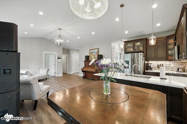 1521 N Kerry Ln, Wasilla, AK 99654 - dining room featuring a chandelier, wood finished floors, recessed lighting, and vaulted ceiling