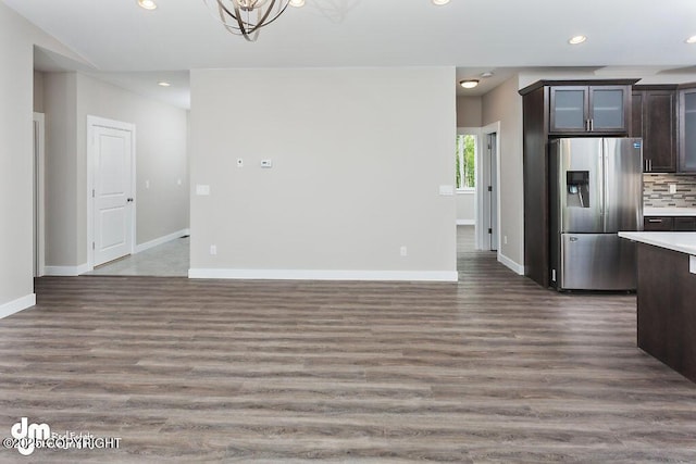 1521 N Kerry Ln, Wasilla, AK 99654 - unfurnished dining area featuring wood finished floors, recessed lighting, and a chandelier
