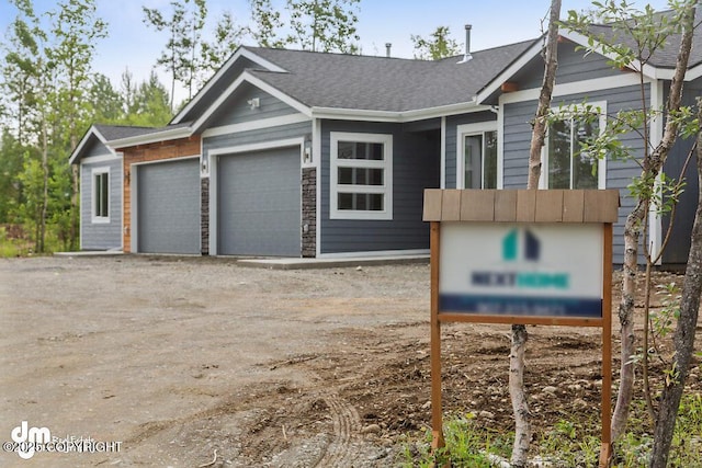 1521 N Kerry Ln, Wasilla, AK 99654 - view of front of property featuring an attached garage and dirt driveway