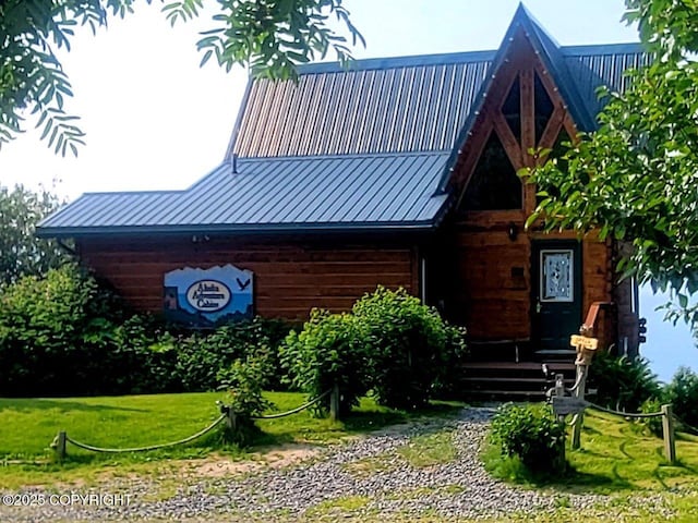 2525 Sterling Hwy, Homer, AK 99603 - view of front of home featuring a front lawn and metal roof