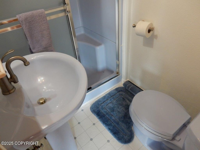 2525 Sterling Hwy, Homer, AK 99603 - bathroom featuring a stall shower, a sink, and toilet