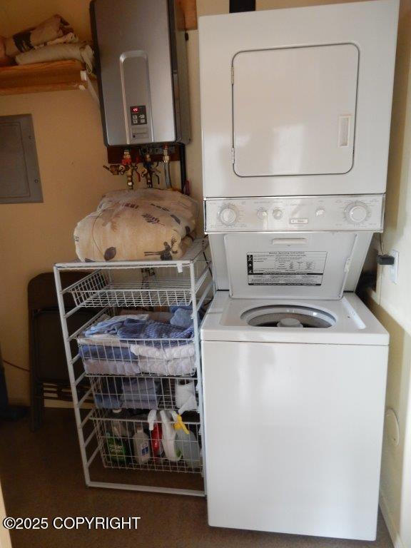 2525 Sterling Hwy, Homer, AK 99603 - laundry area featuring stacked washer / dryer, water heater, and electric panel