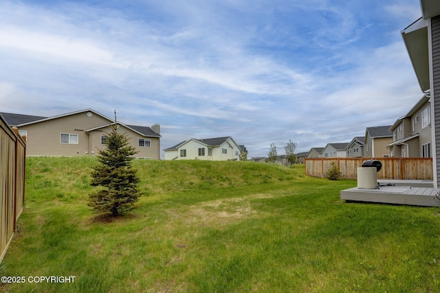 8784 Dry Creek Loop # 40A, Anchorage, AK 99502 - view of grassy yard with a residential view and a wooden deck