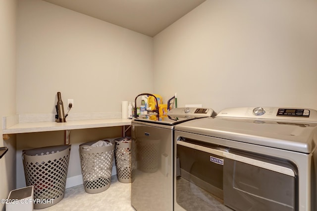 8784 Dry Creek Loop # 40A, Anchorage, AK 99502 - washroom featuring washing machine and clothes dryer