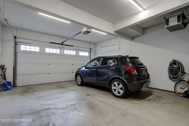 8784 Dry Creek Loop # 40A, Anchorage, AK 99502 - garage featuring a garage door opener