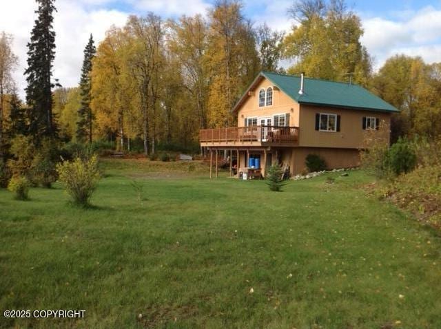 41873 S Running River Dr, Remote, AK 99676 - back of house with a wooden deck and a yard