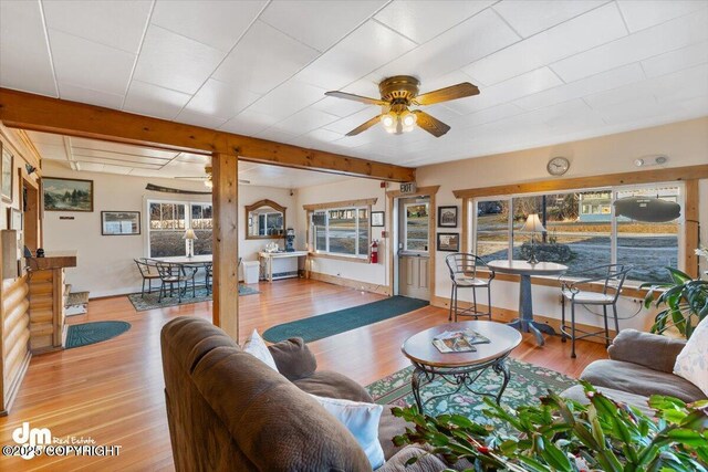 147 E Pioneer Ave, Homer, AK 99603 - living area featuring a ceiling fan, wood finished floors, and baseboards