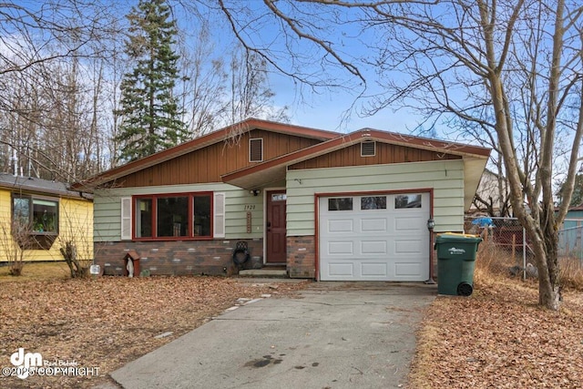 1920 E 56th Ave, Anchorage, AK 99507 - view of front of property with driveway and a garage