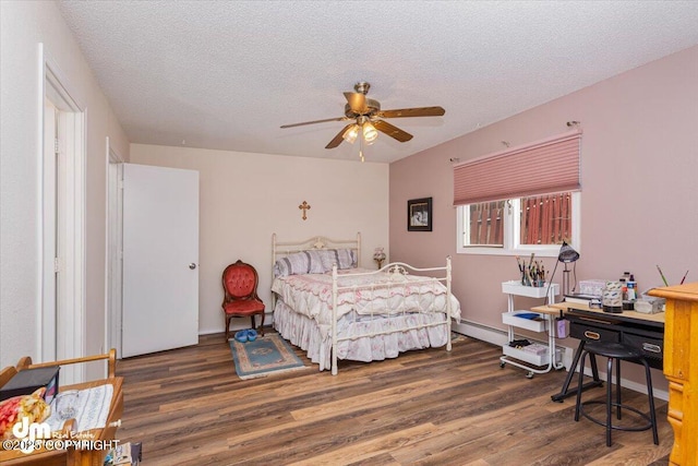 1920 E 56th Ave, Anchorage, AK 99507 - bedroom with wood finished floors, a textured ceiling, a ceiling fan, and a baseboard radiator