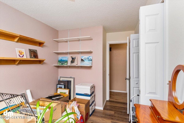 1920 E 56th Ave, Anchorage, AK 99507 - office space featuring wood finished floors, a textured ceiling, and baseboards