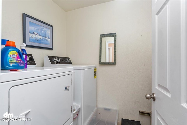 1920 E 56th Ave, Anchorage, AK 99507 - washroom with washing machine and clothes dryer and baseboards
