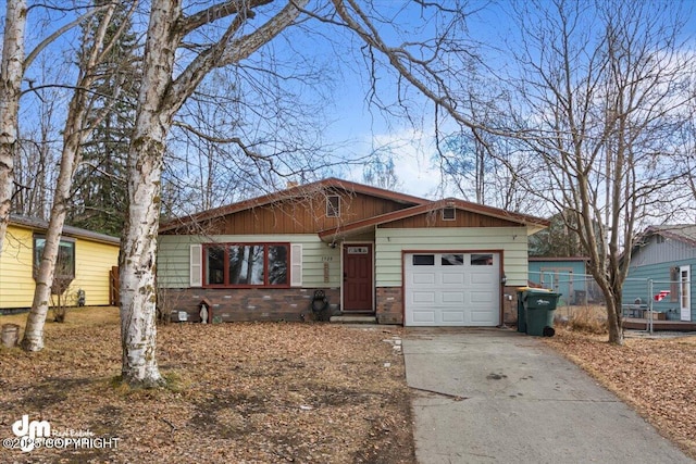 1920 E 56th Ave, Anchorage, AK 99507 - view of front of property with an attached garage, driveway, and brick siding