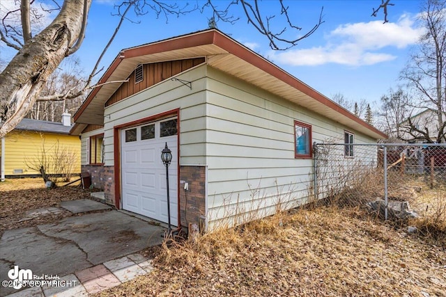 1920 E 56th Ave, Anchorage, AK 99507 - view of side of home with a garage