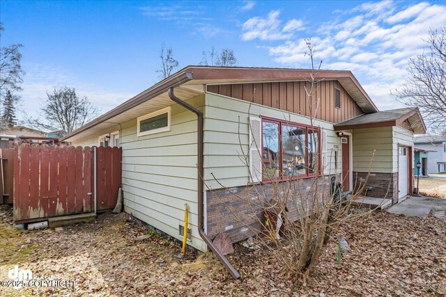 1920 E 56th Ave, Anchorage, AK 99507 - view of property exterior with board and batten siding