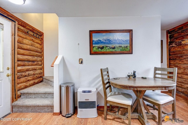 704 S Freeman Way, Big Lake, AK 99623 - dining area featuring rustic walls, stairway, and light wood finished floors