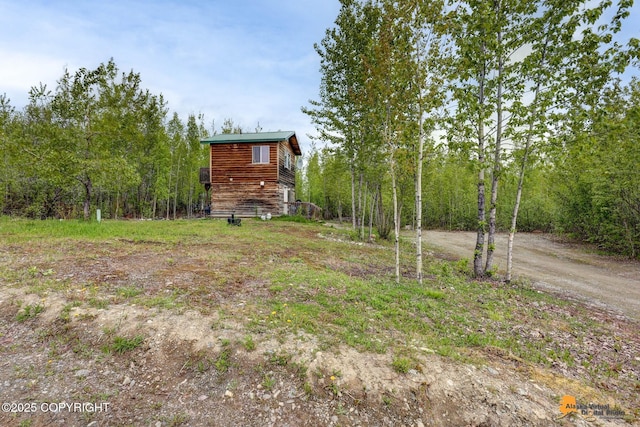 704 S Freeman Way, Big Lake, AK 99623 - view of yard with driveway and a wooded view