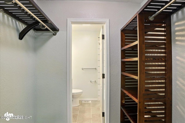 7341 Huntsmen Cir Unit 19C, Anchorage, AK 99518 - spacious closet featuring tile patterned floors
