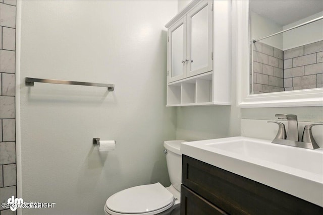 7341 Huntsmen Cir Unit 19C, Anchorage, AK 99518 - bathroom featuring toilet and vanity