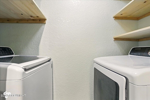 7341 Huntsmen Cir Unit 19C, Anchorage, AK 99518 - laundry room with washing machine and clothes dryer and a textured wall