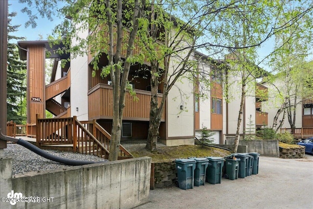7341 Huntsmen Cir Unit 19C, Anchorage, AK 99518 - view of property featuring stairway