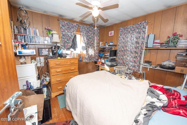 1403 W 34th Ave, Anchorage, AK 99503 - bedroom featuring wooden walls and a ceiling fan