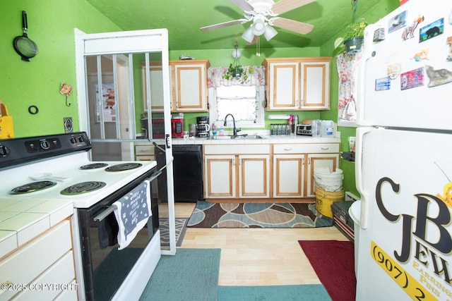1403 W 34th Ave, Anchorage, AK 99503 - kitchen featuring freestanding refrigerator, electric range oven, tile counters, and a sink