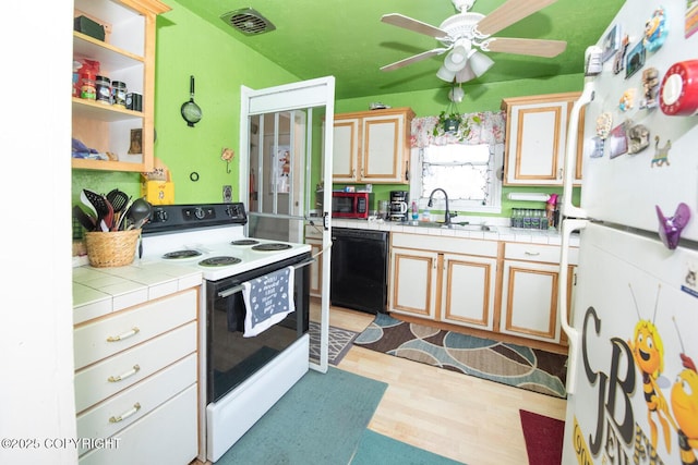 1403 W 34th Ave, Anchorage, AK 99503 - kitchen with white appliances, a sink, tile counters, and light wood-style floors