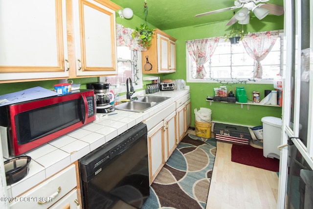 1403 W 34th Ave, Anchorage, AK 99503 - kitchen with a sink, dishwasher, tile countertops, wood finished floors, and ceiling fan