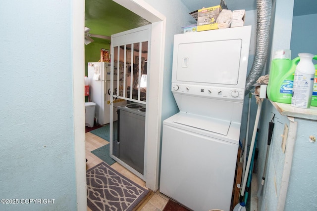1403 W 34th Ave, Anchorage, AK 99503 - laundry area featuring stacked washer / dryer