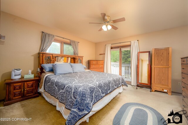 2100 N Palomino Ln, Palmer, AK 99645 - bedroom with light colored carpet, multiple windows, and access to exterior