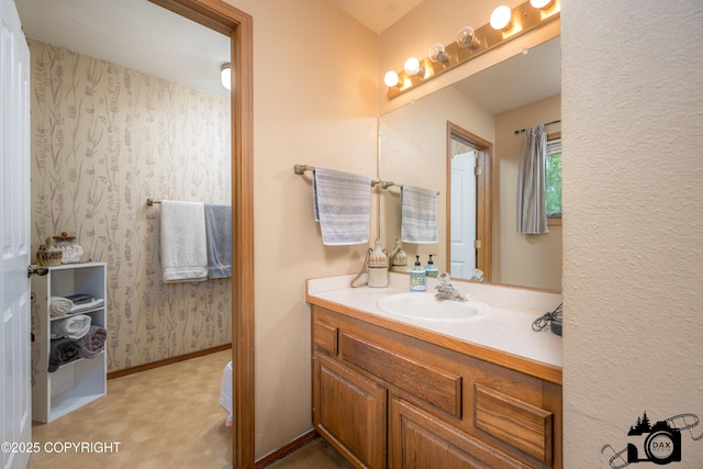 2100 N Palomino Ln, Palmer, AK 99645 - bathroom with vanity, tile patterned floors, and baseboards