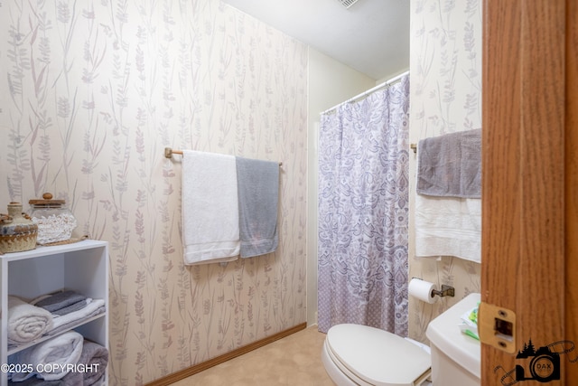 2100 N Palomino Ln, Palmer, AK 99645 - bathroom featuring toilet and baseboards