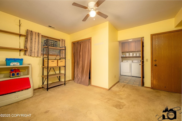 2100 N Palomino Ln, Palmer, AK 99645 - interior space with independent washer and dryer, light colored carpet, and baseboards