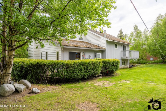 2100 N Palomino Ln, Palmer, AK 99645 - rear view of property with a lawn and a balcony