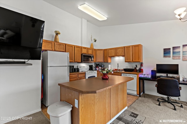 2266 Brookshire Loop, Anchorage, AK 99504 - kitchen with white appliances, high vaulted ceiling, a kitchen island, a sink, and brown cabinetry
