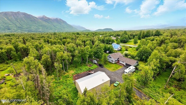 655 N Smith Rd, Palmer, AK 99645 - aerial view of property and surrounding area with a mountainous background and a heavily wooded area