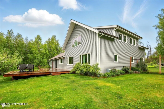 655 N Smith Rd, Palmer, AK 99645 - rear view of house with a deck and a lawn